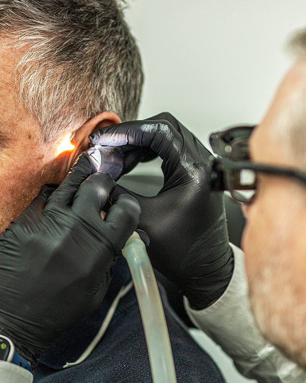 Lee removing ear wax from patient | Ear Wax Removal Near Me | Plymouth Ear Wax Removal | Moor Hearing